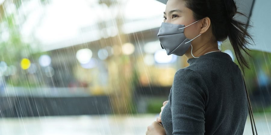 rainy season - rain gear - Asian woman with umbrella and face mask - boost your immunity - health -stay healthy - health tips