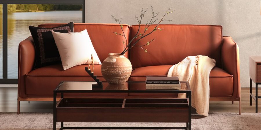 top interior design trends for 2024 - living room - leather sofa - brown - earth colors - neutral - large windows